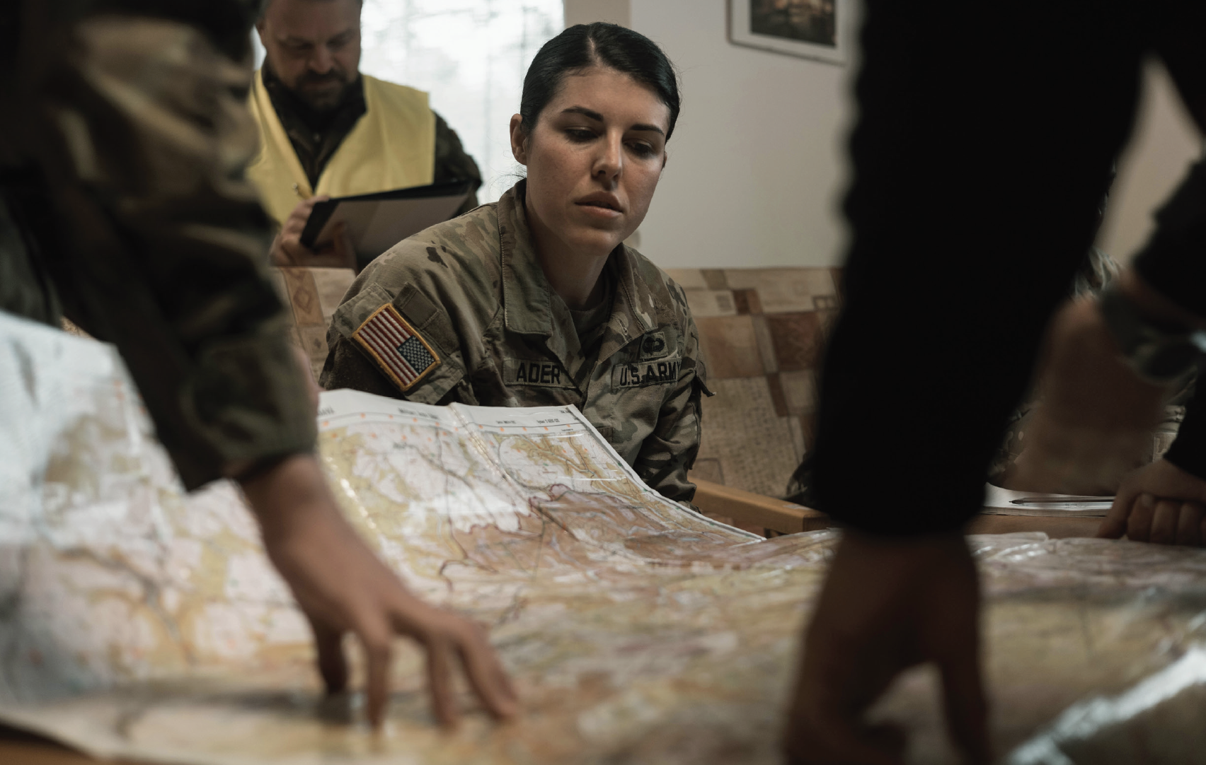Army Captain Bailey Ader assigned to 486th Civil Affairs Battalion gathers information from role player while operating in Civil-MilitaryCooperation center during Powerful Word exercise at Libavá Military Training Area, Czech Republic, October 4, 2024 (U.S. Army/Nolan Brewer)